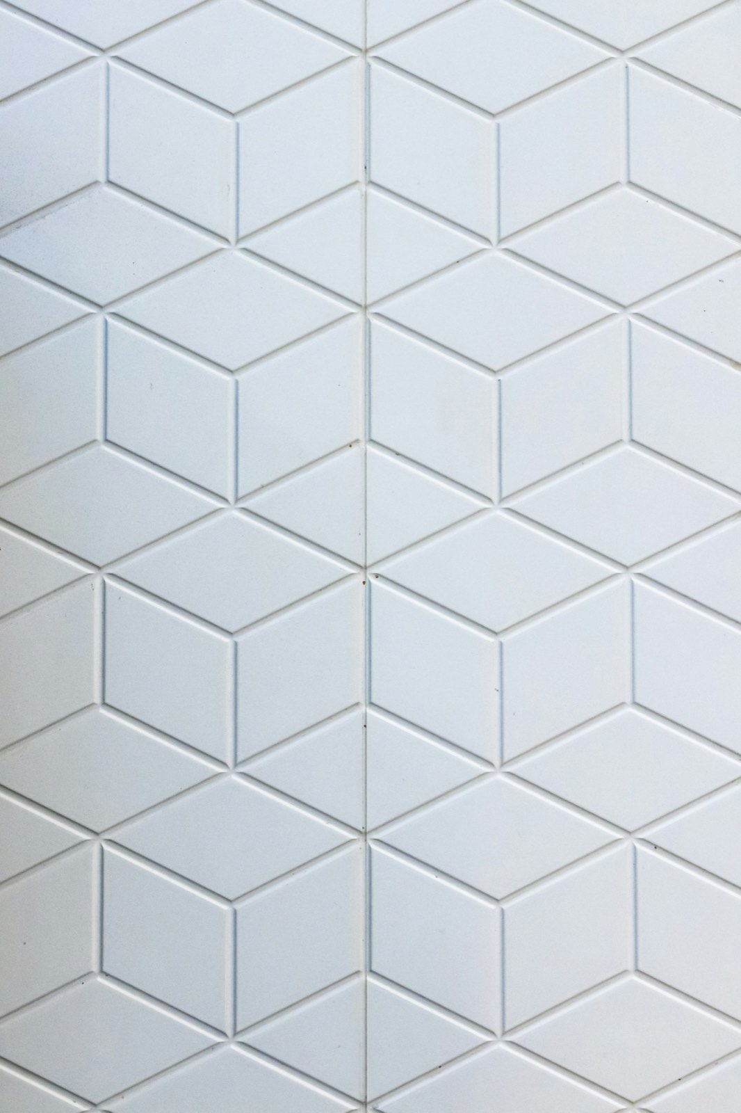 Macro of a white three-dimensional relief tile surface