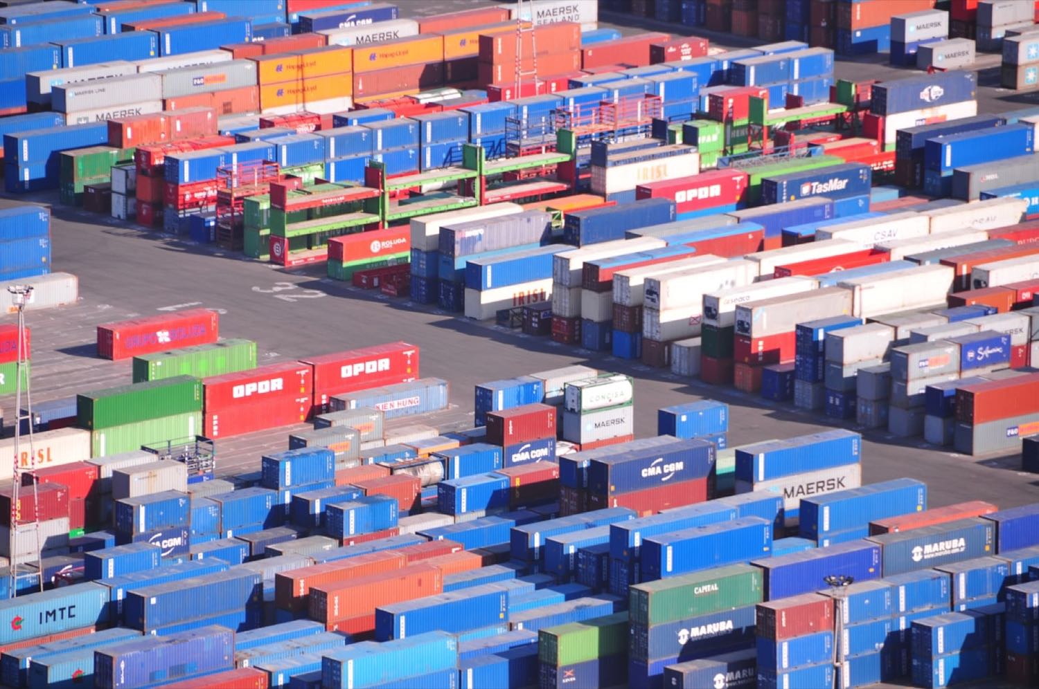 Aerial view of a container yard stacked with shipping containers